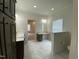 Double vanity bathroom with marble-look flooring and ample storage at 6733 Oscar Barham Rd, Wake Forest, NC 27587