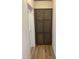 Hallway with built-in storage cabinets and wood flooring at 6733 Oscar Barham Rd, Wake Forest, NC 27587