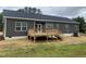 Home exterior showcasing a deck and backyard at 6733 Oscar Barham Rd, Wake Forest, NC 27587