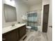 Clean bathroom with vanity, shower, and tiled floor at 6733 Oscar Barham Rd, Wake Forest, NC 27587