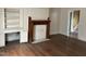 Living room with built-in shelving and hardwood floors at 414 E Morehead St, Burlington, NC 27215