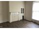 Living room with fireplace, built-in hutch, and wood flooring at 414 E Morehead St, Burlington, NC 27215