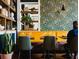 Restaurant interior with yellow booths and patterned chairs at 202 Byrum St # 2, Cary, NC 27511