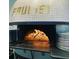 Wood-fired pizza oven with golden mosaic details at 202 Byrum St # 2, Cary, NC 27511