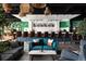 Modern bar interior with teal couches and green walls at 202 Byrum St # 2, Cary, NC 27511