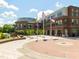 Brick building with a courtyard and flags at 12217 Beestone Ln, Raleigh, NC 27614