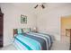 Bright bedroom with a double bed, window, and adjacent bathroom access at 12217 Beestone Ln, Raleigh, NC 27614