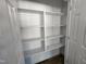 Open pantry with white shelves and ample storage space at 910 West St, Smithfield, NC 27577