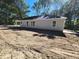 Single-story house with gray siding and a spacious yard at 910 West St, Smithfield, NC 27577