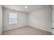 Simple bedroom with neutral walls and carpet at 226 River Bank Rd, Fuquay Varina, NC 27526