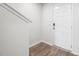 Light and airy entryway with wood-look floors and white door at 226 River Bank Rd, Fuquay Varina, NC 27526