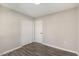 Spacious bedroom with double doors and wood-look floors at 712 Blount St, Smithfield, NC 27577