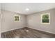 Bright bedroom with two windows and wood-look floors at 712 Blount St, Smithfield, NC 27577
