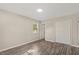 Spacious bedroom with double doors and wood-look floors at 712 Blount St, Smithfield, NC 27577