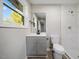 Bathroom with gray vanity, modern fixtures, and a shower at 712 Blount St, Smithfield, NC 27577