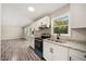 Modern kitchen with stainless steel appliances and granite counters at 712 Blount St, Smithfield, NC 27577