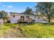 Rear view of house with deck and large yard at 712 Blount St, Smithfield, NC 27577
