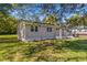 Side view of newly renovated home with green lawn at 712 Blount St, Smithfield, NC 27577