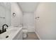 Clean bathroom with a bathtub, vinyl flooring and modern fixtures at 712 Blount St, Smithfield, NC 27577