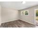 Spacious dining area with hardwood floors and access to deck at 712 Blount St, Smithfield, NC 27577
