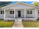 Front porch with black door and white columns at 712 Blount St, Smithfield, NC 27577