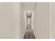 Long hallway with wood-look floors and neutral walls at 712 Blount St, Smithfield, NC 27577