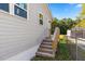Side yard with steps leading to a small deck at 712 Blount St, Smithfield, NC 27577