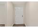Interior entryway with white door and wood floors at 712 Blount St, Smithfield, NC 27577