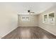 Spacious living room with wood floors and ceiling fan at 712 Blount St, Smithfield, NC 27577