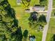 Aerial view of property showing house nestled amongst trees and large yard at 712 Blount St, Smithfield, NC 27577