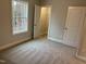 Bright bedroom featuring carpet, large window, and walk-in closet at 2034 Fishamble St, Fuquay Varina, NC 27526