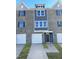 Brick front exterior of a two-story townhome with two-car garage at 2034 Fishamble St, Fuquay Varina, NC 27526