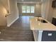 Open kitchen with island and stainless steel sink at 2034 Fishamble St, Fuquay Varina, NC 27526