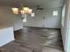 Bright dining room with hardwood floors and chandelier at 87 Furley St., Homesite 112, Sanford, NC 27330