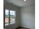 Well-lit bedroom with a window overlooking the neighborhood at 87 Furley St., Homesite 112, Sanford, NC 27330