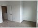 Simple bedroom with window and carpet at 87 Furley St., Homesite 112, Sanford, NC 27330