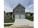 Two story home with gray siding and two car garage at 87 Furley St., Homesite 112, Sanford, NC 27330