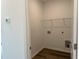 Laundry closet with wire shelving and a utility sink at 87 Furley St., Homesite 112, Sanford, NC 27330