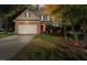 Brick home with two-car garage and mature trees at 65 Applegate Dr, Franklinton, NC 27525