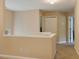 Upstairs hallway with carpet, neutral walls, and access to bedrooms at 65 Applegate Dr, Franklinton, NC 27525