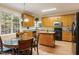 Bright kitchen featuring an island, lots of cabinets, and a breakfast nook at 65 Applegate Dr, Franklinton, NC 27525