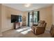 Relaxing bedroom with a comfortable recliner, large window, and plenty of space at 65 Applegate Dr, Franklinton, NC 27525