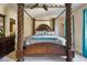 Elegant bedroom featuring a stunning four-poster bed and teal accents at 65 Applegate Dr, Franklinton, NC 27525