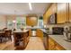 Eat-in kitchen boasting an island, stainless steel appliances, and corner sink at 65 Applegate Dr, Franklinton, NC 27525