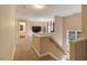 Spacious upstairs hallway showcasing a built-in railing and natural light at 65 Applegate Dr, Franklinton, NC 27525