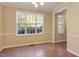 Simple dining room with large window and tile floors at 65 Applegate Dr, Franklinton, NC 27525