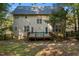 Spacious deck with wood railings and two teal Adirondack chairs at 65 Applegate Dr, Franklinton, NC 27525