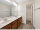 Shared bathroom with double vanity and tub at 9 Oxmoor Dr, Durham, NC 27703