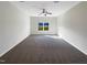 Spacious bedroom with carpet and a large window at 9 Oxmoor Dr, Durham, NC 27703