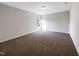 Upstairs bedroom with one window and neutral decor at 9 Oxmoor Dr, Durham, NC 27703